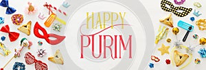 Purim celebration concept & x28;jewish carnival holiday& x29; over wooden white background. Banner.