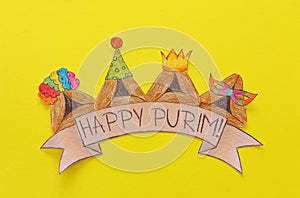 Purim celebration concept & x28;jewish carnival holiday& x29;. Traditional hamantash cookies cutted from paper and painted.