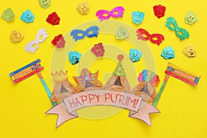 Purim celebration concept & x28;jewish carnival holiday& x29;. Traditional hamantash cookies cutted from paper and painted.