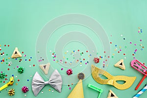 Purim celebration concept (jewish carnival holiday) over mint background photo