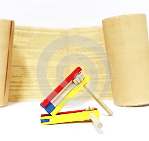 Purim . Colorful wooden noisemaker with Megillah Purim holiday background photo