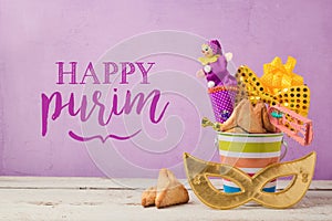 Purim holiday greeting card with carnival mask and gifts