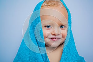 Purity and hygiene education. Child in clean and dry towel. Happy bath time. Image of cute baby boy covered with towel