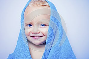 Purity and hygiene education. Child in clean and dry towel. Happy bath time. Image of cute baby boy covered with towel