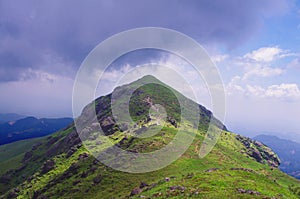 Purpl cloud around the mountaintop photo