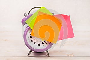 The purple alarm clock has an orange blank sticker. Business planning and development concept