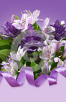 Purple alstroemeria and ornamental cale with green leaves with satin ribbon on violet background for festive card