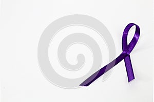 Purple awareness ribbon on white background