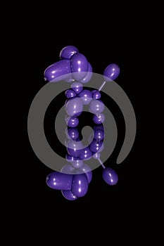 Purple balloon animal poodle dog over reflection on black