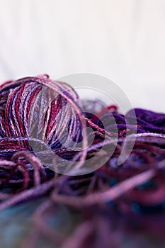 Purple balls thread on blue and white background