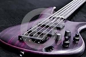 Purple bass guitar (shallow depth of field)