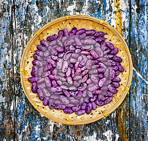 Purple beans in a wicker bowl