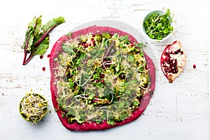 Purple beetroot dough, vegetables and sprouis pizza, Healthy fast food