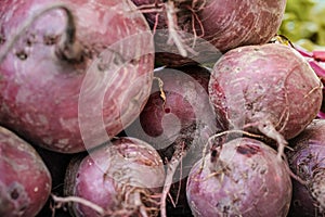 Purple beetroots displayed at street food market, closeup detail