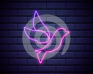 Purple bird neon sign. Luminous signboard with flying bird against brick wall. Night bright advertisement. Vector illustration in