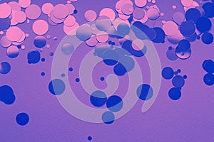 Purple and blue confetti on the purple paper background