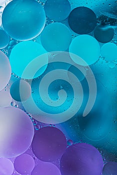 Purple, Blue Gradient Oil drops in the water -abstract background