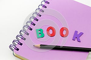 Purple book with pen. Image use for learning, education, memory concept