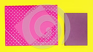 Purple book and pink stationery appear on yellow theme. Stop motion