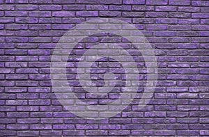 Purple brick wall background, wallpaper. Purple bricks pattern, texture photo