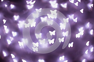 Purple butterfly bokeh lights. Bokeh defocused background