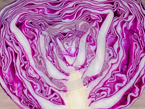 Purple cabbage on cutting boards on Wooden table .