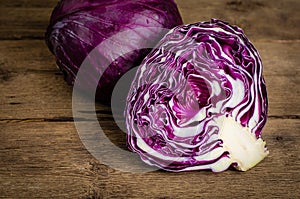 Purple cabbage or red kraut on wooden rustic background.
