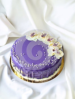 Purple cake with tasty flowers