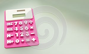 Purple calculator made of rubber use math calculations with copy space