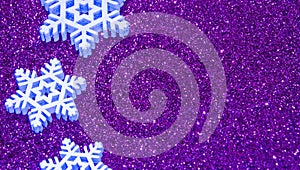 Purple christmas background with neon snowflakes. Christmas New Year greeting card with trendy sparkling glitter. Seasonal