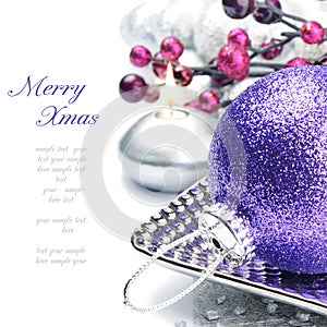 Purple Christmas ball on festive background