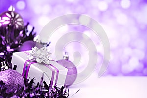 Purple Christmas scene with baubles and gift