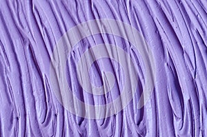 Purple clay alginate face mask, body wrap, hair conditioner texture close up, selective focus. Abstract lavender background