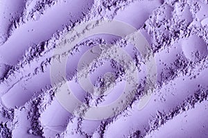 Purple clay powder alginate face mask, body wrap, make-up eyeshadow texture close up, selective focus.