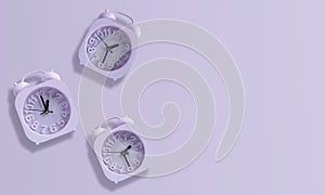 Purple Clock Isolated On Pastel Purple Background. 01:30 Hours, 01:00 Hours, 02:30 Hours. Alarm Clock Purple