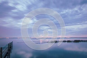 Purple sunset on Lake Monroe at the boat ramp in Deltona, Florida photo