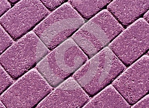 Purple color cobblestone pavement surface.