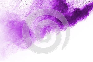 Purple color powder explosion on white background.