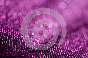 Purple color textile with sparkles close-up. Fabric background