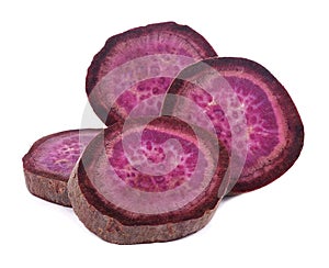 Purple Colored Sweet Potatoes on White background