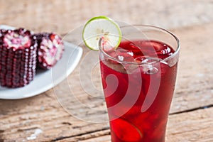 Purple corn juice wood table background