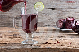 Purple corn juice wood table background