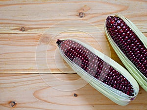 Purple corn or purple maize on wooden background
