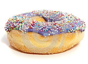 A purple donut with colorful speckles