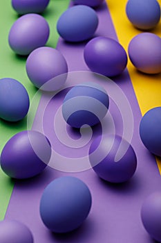 Purple easter eggs on a colored background