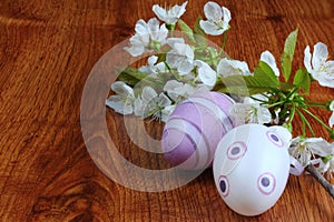 Purple easter eggs decorated with cherry blossom