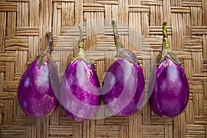 Purple eggplant on bamboo craft