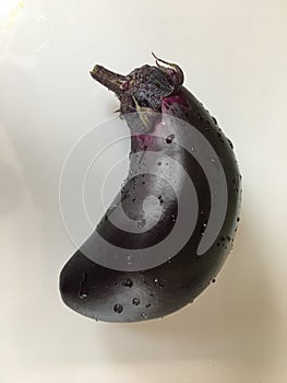Purple eggplant on a white table