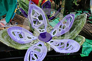 Purple Embroidery flowers, in a brass double bed frame,