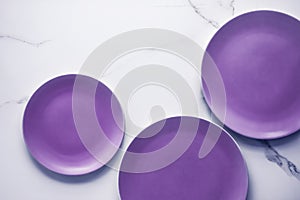 Purple empty plate on marble table background, tableware decor for breakfast, lunch and dinner for restaurant brand menu recipe,